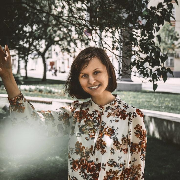 Kaveri Mehta, Lead Design Curator at MarinaCanyonCliffSide, reviewing corporate floral arrangements